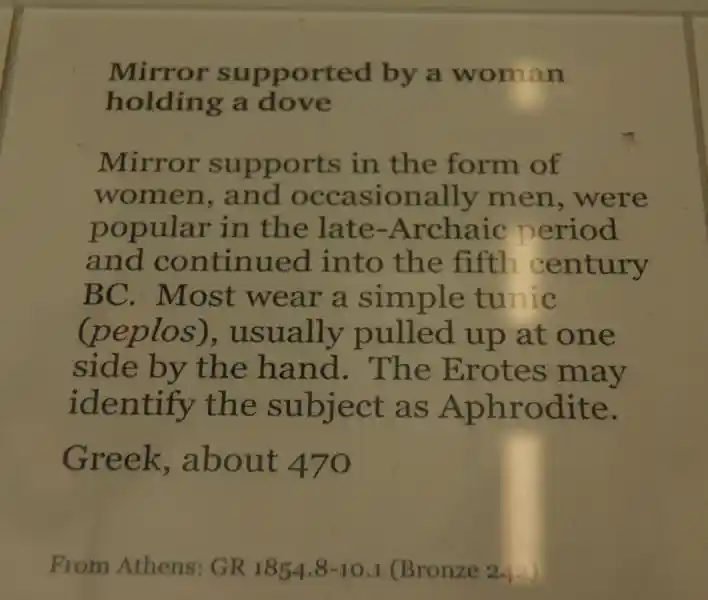 Mirror supported by a woman holding a dove